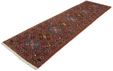 Angled perspective of the vintage Ardebil runner, showing its full pile and geometric diamond medallions.