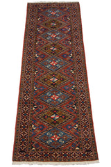 Full length of a vintage Ardebil runner from an angle, emphasizing its continuous geometric pattern.
