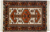 Central rust medallion, arrowed finials with germinating plants, birds, and botehs on ivory field.
