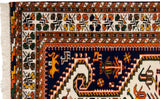 Northwest Persian rug corner: white fringe, rust borders, and saffron lion on navy.