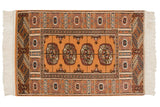 Vintage Indian Bokhara design rug with geometric guls in navy and chestnut on a saffron yellow field.