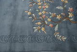 Floating carved border and Art Deco floral spray with blush, seafoam, and denim blue.