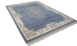 Vintage Indian Aubusson design carpet showing ivory floral vinery border and fringe.