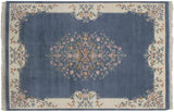 Vintage Indian Aubusson rug bottom corner, ivory floral border with buds, denim field, fringe.