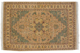 Stepped medallion and serrated floral vinery pattern in pale sand, seafoam green, dusty blush.