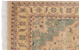 Vintage Indian Heriz carpet with stepped seafoam green medallion contour and meandering floral border.
