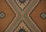 Detail of Dhurrie rug with stepped medallions and dark serpent motifs on gold, blue, ivory.
