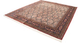 Lattice panels with tree-of-life motifs, Rococo vinery, and brick red border on Indian rug.