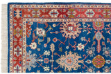 Hand-knotted vintage Indian Bijar rug's corner with fringe and geometric terracotta border.