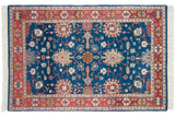 Vintage Indian Bijar design rug corner: sapphire blue field with vinery, geometric terracotta red border, fringe.