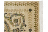 Carved wool pile of the blossom and arabesque borders on an Indian Savonnerie rug.