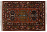 White fringe at the corner of a rust field rug with multi-cartouche and serpent borders.