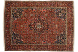 Collector's vintage Bakhtiari rug featuring a central medallion, sapphire blue spandrels, and a dense red boteh field.