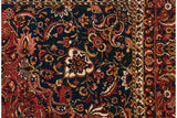 Saffron yellow and brick red paisley botehs on the sapphire blue field of a vintage Bakhtiari.