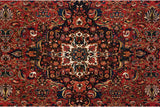 Hand-knotted center medallion with palmettes and botehs on a vintage Bakhtiari collector carpet.
