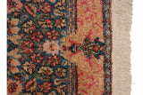 Close-up showing the original secured side cord and clean ivory fringe of the vintage Kerman.