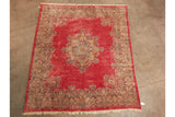 Kerman carpet's detailed floral border with thousand flower motif on deep pink field.