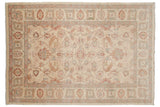 Pakistani Sultanabad carpet's field and border showcasing floral palmettes, vinery in ivory, red, blue.