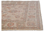 Sultanabad carpet corner with ivory, terra cotta, blue-green floral palmettes and intact selvage.