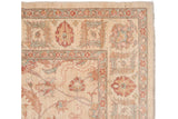 Hand-knotted vintage Sultanabad rug corner displays ivory, terra cotta, blue-green floral details.