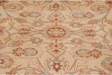 Pakistani Sultanabad rug's hand-knotted pile with soft cinnabar, blue-green floral details.