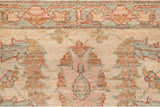 Ivory, terra cotta, and blue-green floral palmettes and vinery on the Sultanabad rug.