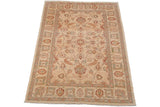 Detailed corner of the Sultanabad design rug showcasing ivory ground with floral palmettes and blue-green vines.
