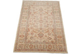 Detail of Pakistani Sultanabad design rug: ivory field with pale cinnabar, blue green palmettes, vinery.