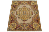 Indian Aubusson design carpet corner, displaying Rococo floral vine motifs in cream, gold, and wine red.