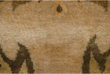 Polished wool pile with expressive palmette motif in cream, beige, and olive green.