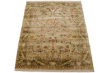 Vintage Indian Arts and Crafts rug corner detail: flowing border, two-tone leaves, and red floral palmettes.