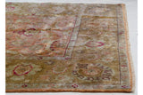 Wide floral border and original side cord selvage on the vintage Agra square carpet.
