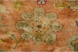 Macro detail of the full, plush pile showing a floral cross-section in ochre green.
