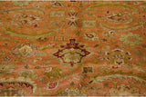 Hand-knotted detail of oversized palmettes and sprawling leaves on a vintage Agra carpet.