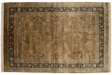 Overhead view of a vintage Tabriz design carpet with a brown floral field and dark navy border.