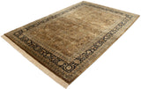 Vintage Tabriz design carpet from an angle, showing its copper brown field and dark navy border.