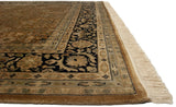 Corner of a vintage Tabriz design carpet with a navy floral border, even pile, and ivory fringe.