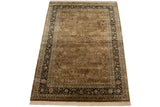 Full layout of a vintage Indian Tabriz rug with a dusty copper field and dark navy floral border.