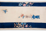 Chinese Art Deco runner detail: thick ivory pile, sky blue butterfly, and thick cobalt blue border.