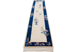 Vintage Art Deco rug corner, cobalt blue border, ivory field, floral spray accents, butterfly, fringe.