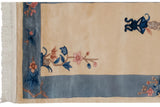 White fringe, pink and blue floral spray on sky blue Art Deco border.