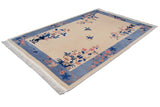 Corner detail of Art Deco carpet: thick sky blue border, pink, blue floral sprays.