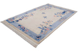 Intact ivory fringe and original side cord selvage detail of the vintage Art Deco rug.