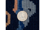 Art Deco carpet hand-knotted pile in cobalt blue, sky blue, and beige, quarter for scale.