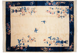 Art Deco rug corner: cobalt blue border, ivory field, pink floral sprays, and butterfly.