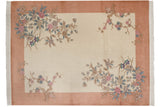 Vintage Chinese Art Deco rug with ivory field, dusty coral border, and pastel rose branches.