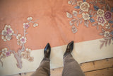 Shallow carved coral Art Deco carpet field, blossomed branches, and antique ivory border.