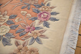 Vintage Art Deco rug with carved coral, mauve, denim blue floral pattern and fringe.