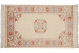Vintage Peking rug: ivory field, roundel medallion, floral cartouche border in pastel tones, 3' x 5'.