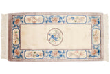 Ivory vintage Peking runner with roundel medallion and mating blue birds.